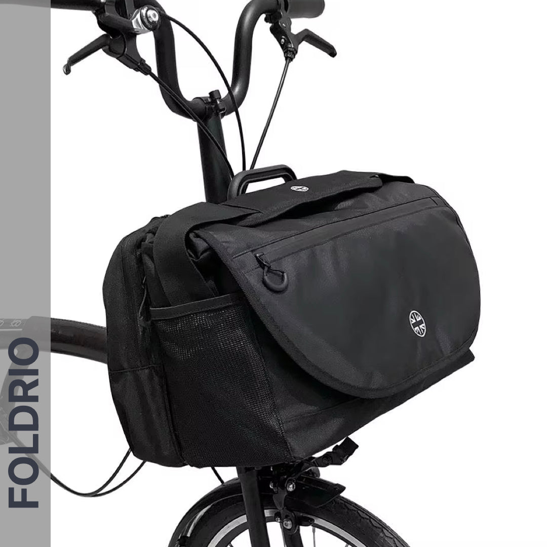 Brompton Brompton S Bag in black with flap, circular logo, side pockets, and vertical “FOLDRIO” for front carrier block | Foldrio. Foldrio