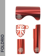 Four metallic red Brompton Frame Protector Set pieces with British flag cutouts, including a rear fork cover and chainstay guard, are displayed vertically. FOLDRIO branding appears on the grey side panel—perfect for protecting your Brompton bike.