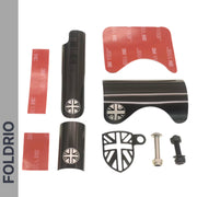 The FOLDRIO Brompton Frame Protector Set with British Flag includes black metal protectors, red 3M adhesive strips, a black shield chainstay guard, and two screws, shown on a white background with the FOLDRIO logo on the left.