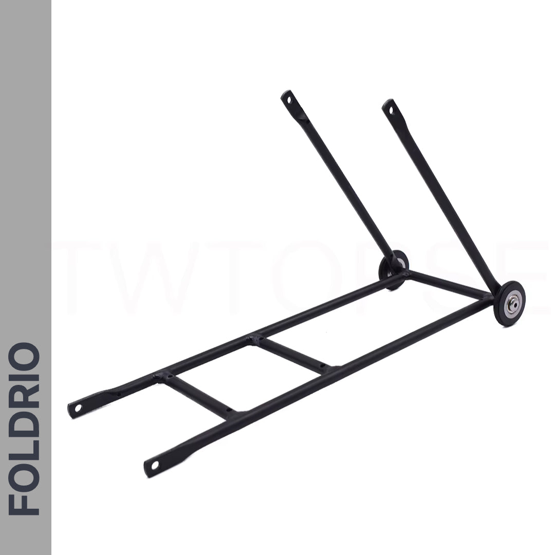 The Brompton Rear Rack – Lightweight Aluminium Cargo Rack is a black metal rack with two support arms, two mounting points, and easywheel mounts. "FOLDRIO" appears in bold on the left. The ultralight rack is displayed on a white background.