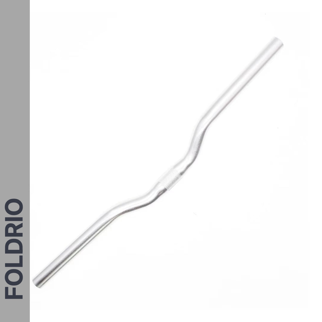 A Brompton M Handlebar in anodised aluminium, available in 5 colours, is shown on a white background. The word FOLDRIO appears vertically on a gray bar along the left side.