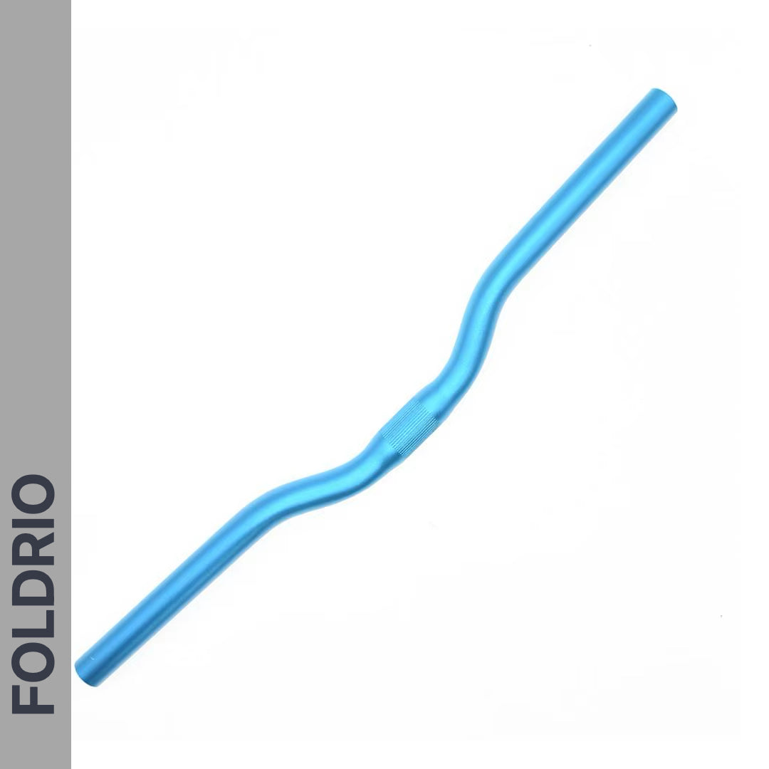 A Brompton M Handlebar in anodised aluminium, available in 5 colours, with a slight rise and curve for upright riding, is displayed on a white background. The left side shows a grey strip with “FOLDRIO” in bold black letters.