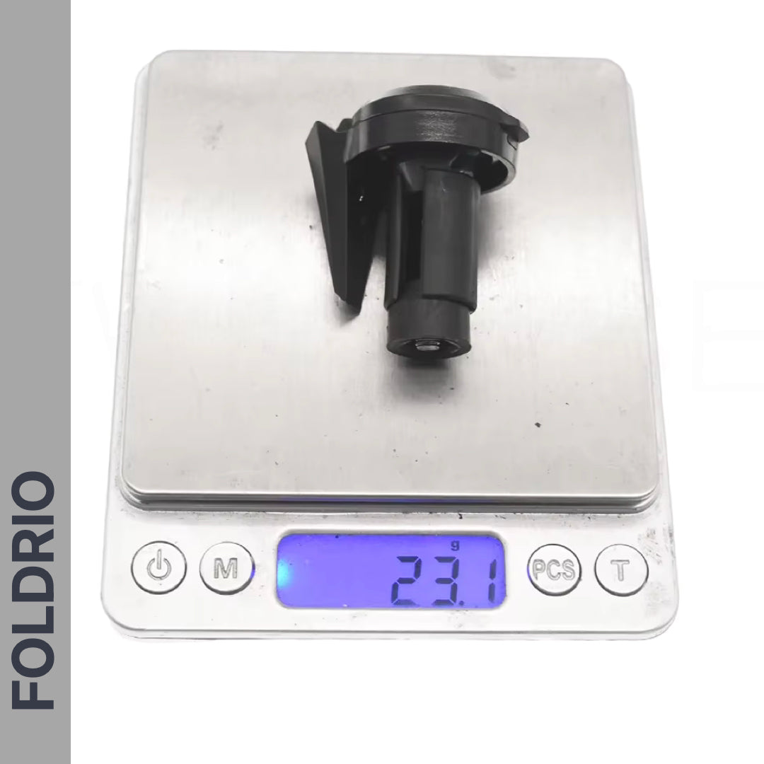 A Brompton Bar End Mirror – 360° Adjustable, Foldable, is shown on a digital kitchen scale with a metal surface. The display reads 23.1 grams in blue light. "FOLDRIO" appears vertically on the left side of the image.