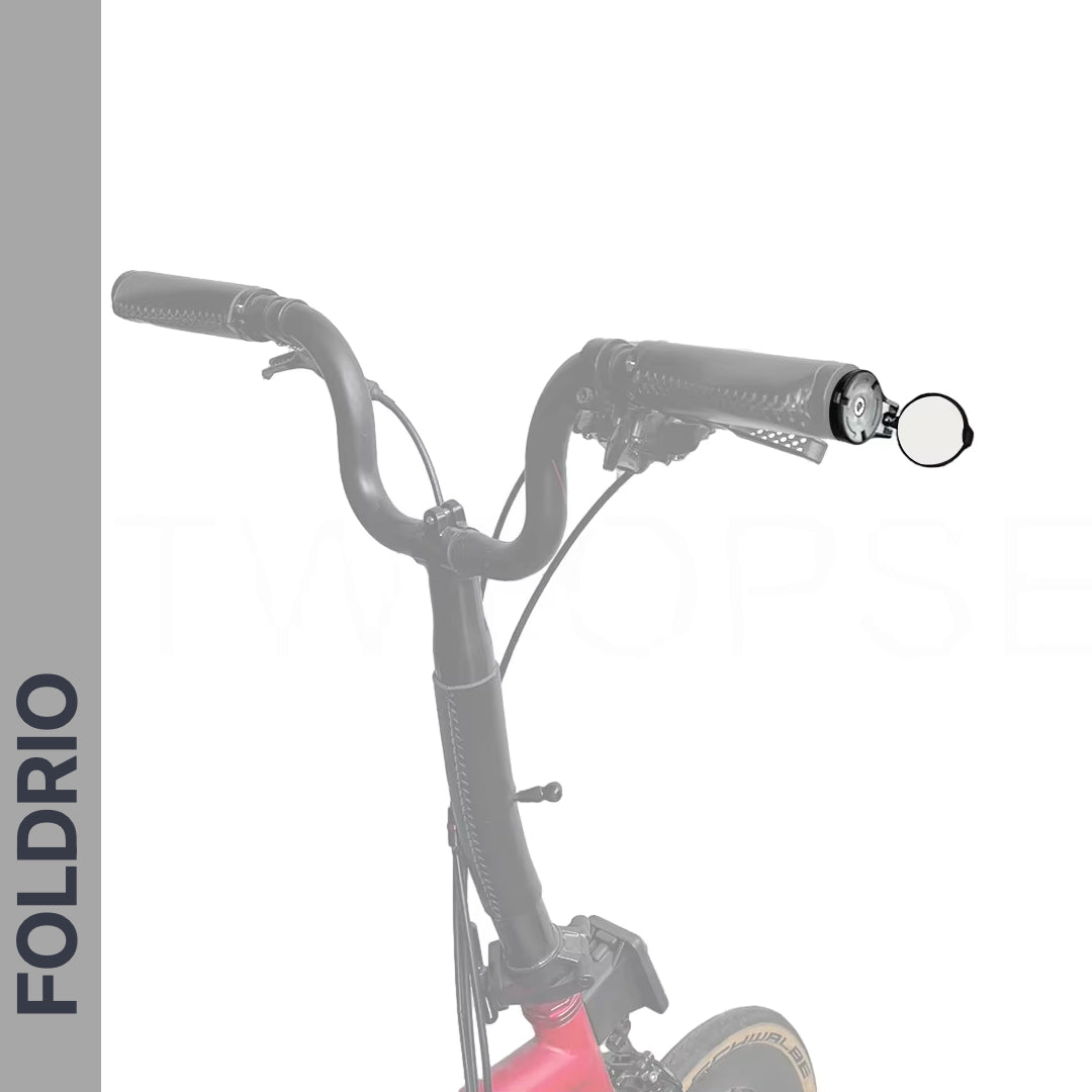 Handlebars of a folding bicycle with focus on the open end of the right grip, perfect for installing a Brompton Bar End Mirror – 360° Adjustable, Foldable. The gray vertical bar on the left displays “FOLDRIO” in bold letters.