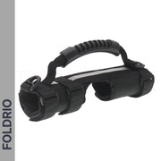 The Brompton Carry Handle & Shoulder Strap – Folded Bike Carrier, with a black soft-grip handle, adjustable straps, two circular openings, and sturdy build, is shown on a white background featuring the FOLDRIO logo for brand visibility.