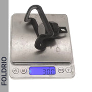 A FOLDRIO Brompton Phone Mount – Lightweight, No Case Needed, sits on a digital scale reading 30 grams. The brand name FOLDRIO appears vertically along the left side of the image.