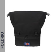 The FOLDRIO Brompton Roll-Top Front Bag – 27.5L is a black commuter and laptop backpack with a front zipper pocket and Union Jack patch, styled for Brompton bikes. "FOLDRIO" appears vertically on the left side of the image.