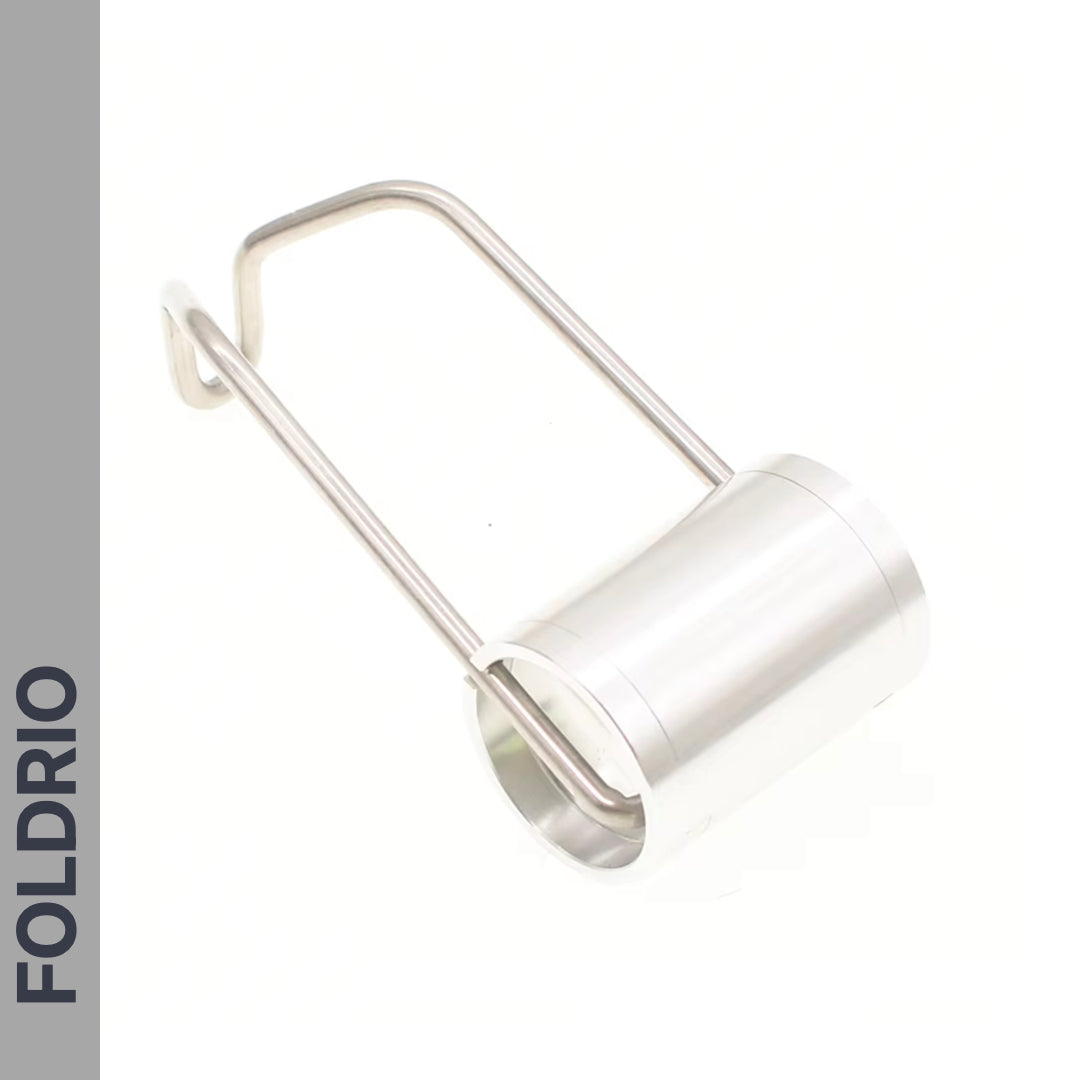 A cylindrical metallic Brompton Front Fork Light by FOLDRIO with a sleek handle, shown on a white background. "FOLDRIO" appears vertically in bold dark letters. It offers an adjustable beam and up to 400 lumens; USB-C rechargeable.