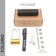The image shows the contents of a FOLDRIO Brompton Front Fork Light package: a 400 lumen USB-C rechargeable black light, brown box, gold bracket part, rubber strap, USB cable, bolts, and washers.