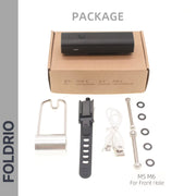 A FOLDRIO Brompton Front Fork Light – 400 Lumen USB-C Rechargeable package includes a black device, metal bracket, black strap, two USB cables, bolts, washers, and fits M5/M6 front holes for adjustable bike light mounting.