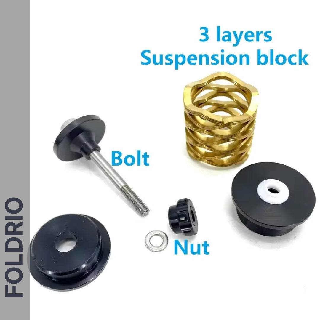 Components of the FOLDRIO Brompton Rear Shock Absorber are shown on a white background: a gold 3-layer spring, titanium bolt, nut, washer, and two black end caps. Blue text labels each part; "FOLDRIO" appears vertically on the left.