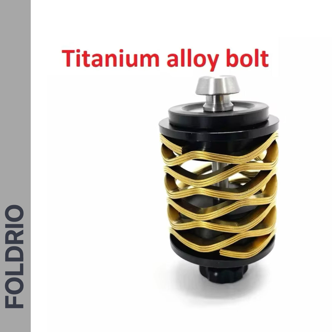 A Brompton Rear Shock Absorber by FOLDRIO, ideal for folding bike upgrades, showcases a unique spiral gold and black design against a white background. “Brompton Rear Shock Absorber” appears above, with “FOLDRIO” vertically on the left.