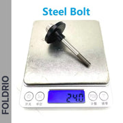 A FOLDRIO Brompton Rear Shock Absorber rests on a digital scale, displaying 24.0 grams. The black-flanged steel part is labeled above the scale, indicating its use as suspension material for Brompton folding bikes.