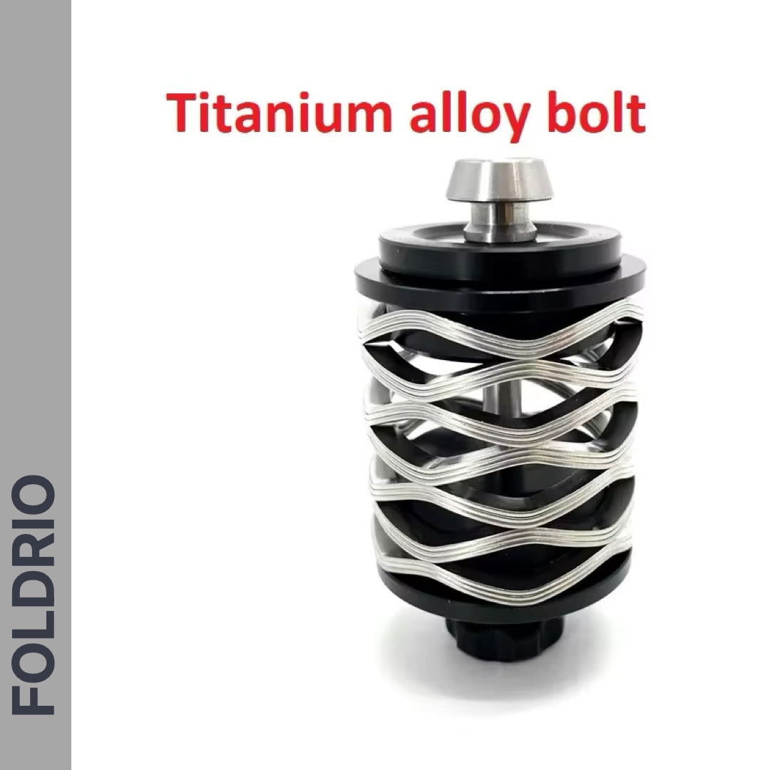 A metallic silver Brompton Rear Shock Absorber by FOLDRIO, crafted from titanium alloy with a unique helical design. Red text states "Titanium alloy bolt" and "FOLDRIO" appears vertically on the left. Ideal for Brompton folding bikes.