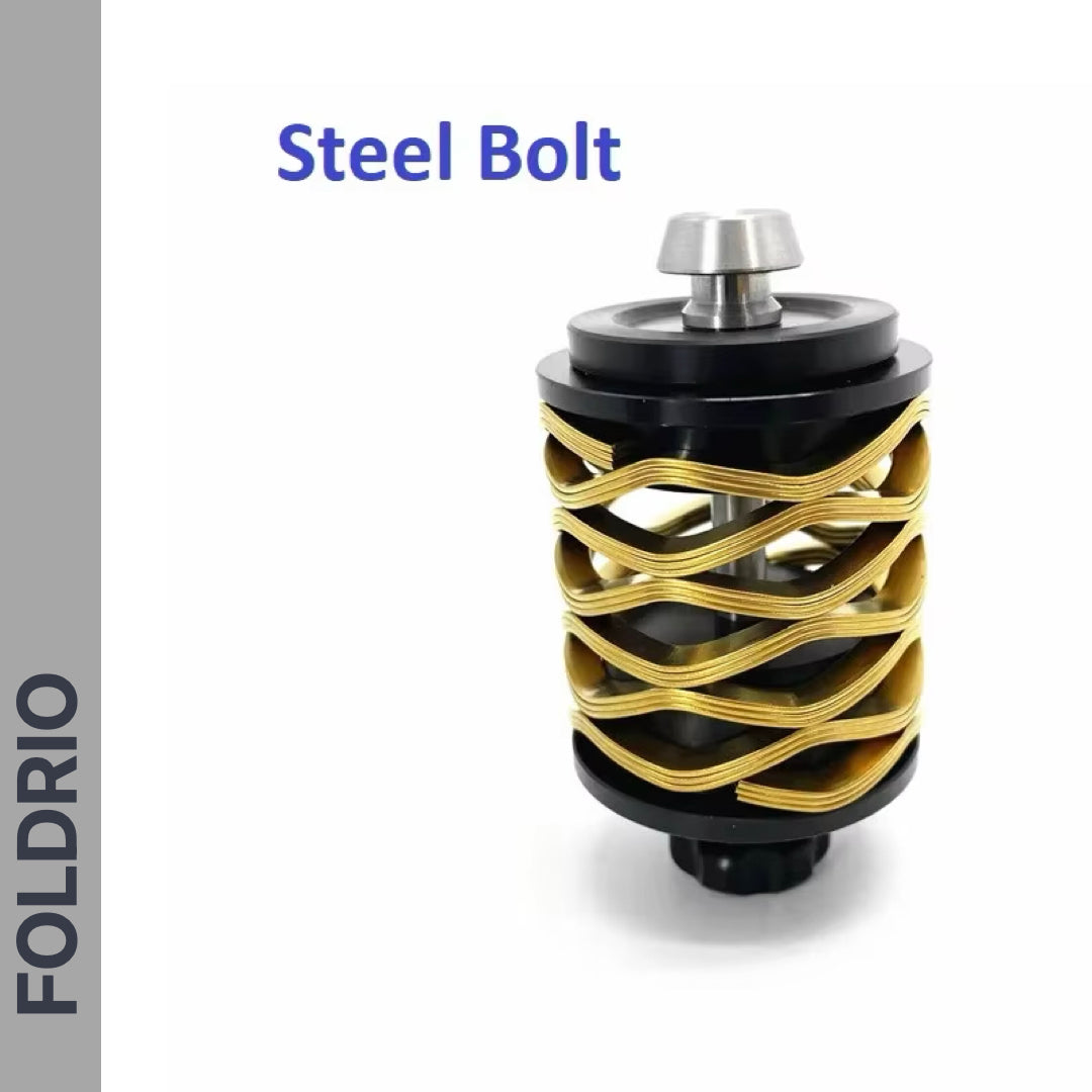 A close-up of a gold and black cylindrical Brompton Rear Shock Absorber by FOLDRIO, featuring a wavy gold design and displayed against a white background with "FOLDRIO" written vertically on the left.