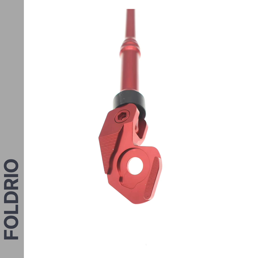 A close-up of the FOLDRIO Brompton Kickstand – Adjustable Aluminium for A and C Line, shown against a white background with "FOLDRIO" vertically on a gray side banner.