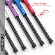 Five FOLDRIO Brompton Kickstand – Carbon Fibre, P and T Line models with colorful aluminum handles and black carbon shafts are displayed side by side, reflecting their sleek design. Text labels read "Aluminum" (handles) and "Carbon" (shafts).