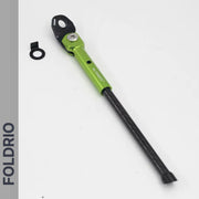 A Brompton Kickstand – Carbon Fibre for P and T Line bikes by FOLDRIO, green and black, adjustable with included washer, is shown on a white background. The word FOLDRIO appears vertically on a sleek grey sidebar.