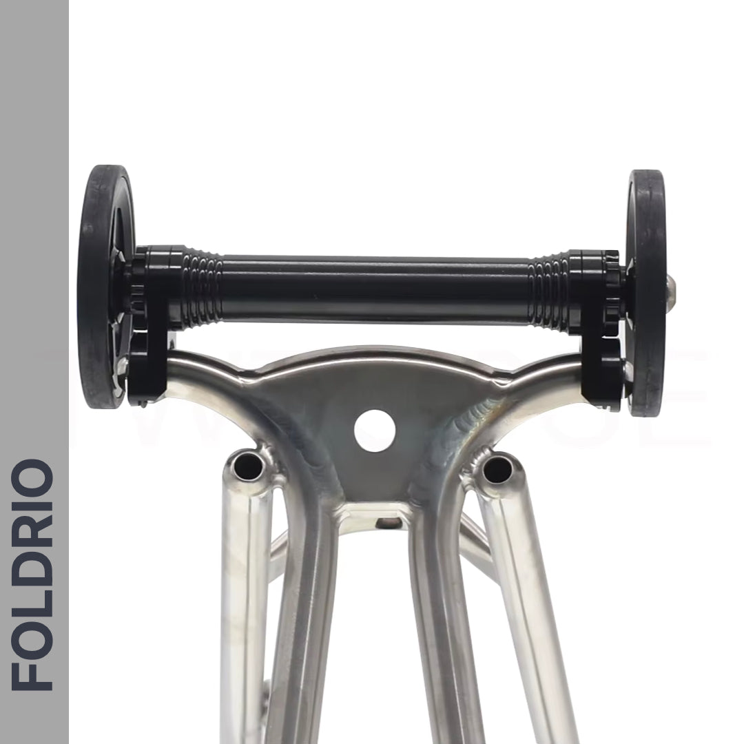 Brompton Brompton Easy Wheel & Extension Rod Set features two alloy wheels, black axle, and "FOLDRIO" logo on gray | Foldrio. Foldrio