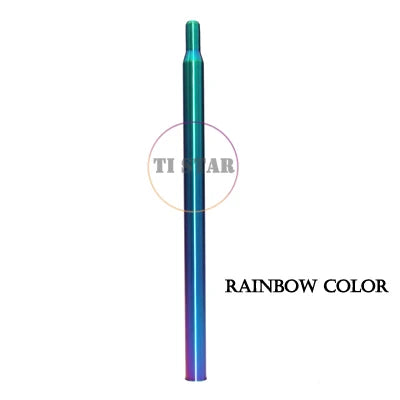 A metallic, cylindrical Brompton Titanium Seatpost – Multicolour Edition by FOLDRIO with an iridescent rainbow finish is displayed vertically on a white background. The words "RAINBOW COLOR" appear on the right side.