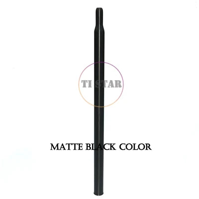 A long, slender Brompton Titanium Seatpost – Multicolour Edition by FOLDRIO with a matte black finish stands vertically against a white background. “MATTE BLACK COLOR” appears below.